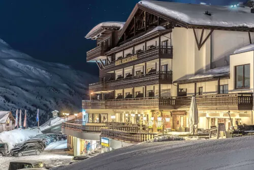 Hotel Hochgurgl at night covered with snow in winter
